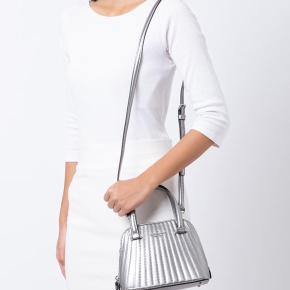 kate spade Handbags - Kate Spade NWT silver mini dome crossbody🔥🔥